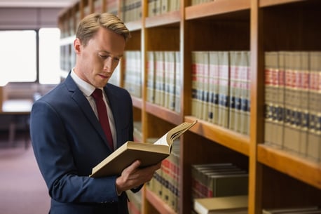 Handsome lawyer in the law library at the university.jpeg